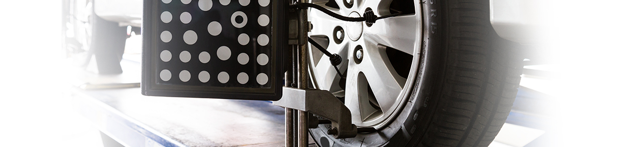 wheel alignment procedure taking place as a part of tyre care and maintenance
