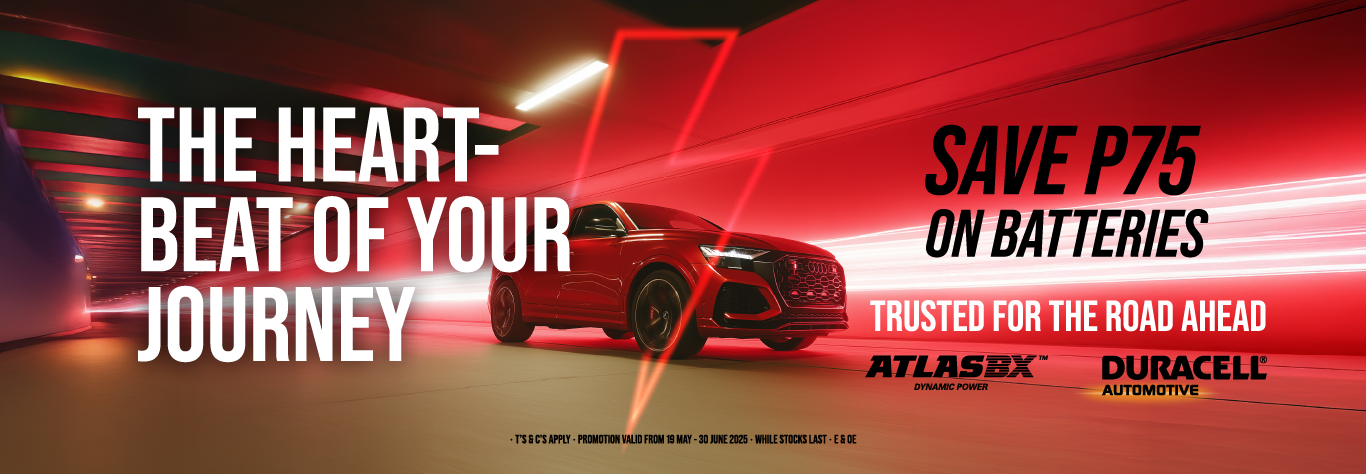 battery campaign banner: an SUV driving through a red lit tunnel